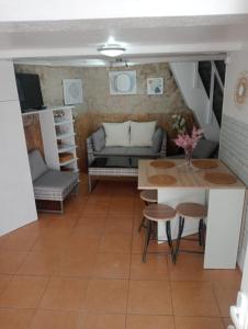 a living room with a couch and a table at La Casita in Cangas de Morrazo