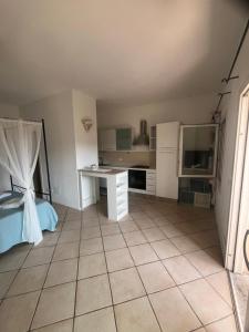 a bedroom with a bed and a desk in it at Casa Stella Residence Ea Bianca Baja Sardinia in Baja Sardinia