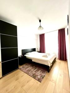 Un pat sau paturi într-o cameră la Urban Nest Moșilor- Obor