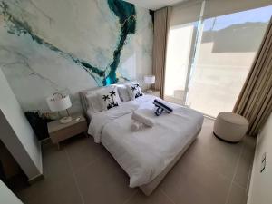 Un ou plusieurs lits dans un hébergement de l'établissement Baia Kristal - Vacaciones Cartagena Colombia