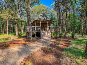 a home with a gazebo in the woods at UpCountree Cabins Romantic Treehouse & Luxury Glamping in Point