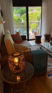 a living room with a couch and a table at Pombal Bayona in Baiona
