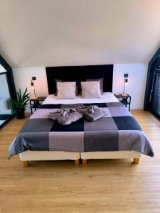 Posteľ alebo postele v izbe v ubytovaní KASZUBSKI LOFT Sominy