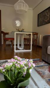 a living room with a table and chairs at Pombal Bayona in Baiona