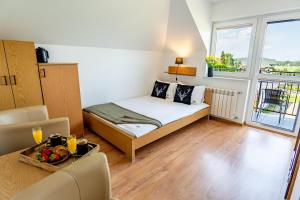 Noclegi Rezydent Polańczyk客房内的一张或多张床位