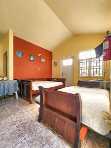 Postel nebo postele na pokoji v ubytování Casa Robinson Guest House