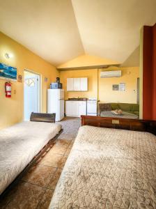 Postel nebo postele na pokoji v ubytování Casa Robinson Guest House