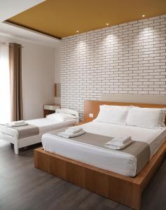 Postel nebo postele na pokoji v ubytování Sunrise Luxury Apartments