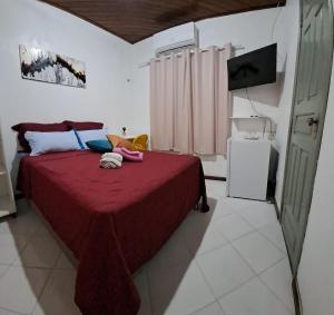 A bed or beds in a room at Suíte com ar condicionado próximo ao Estádio Mangueirão