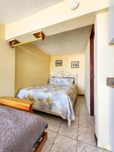 Postel nebo postele na pokoji v ubytování Casa Robinson Guest House