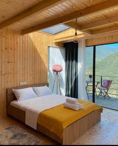 Postel nebo postele na pokoji v ubytování Lemanor lodge - Mountain cottages in Georgia