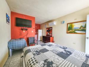TV a/nebo společenská místnost v ubytování Casa Robinson Guest House