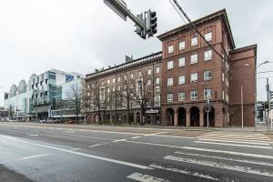 an empty street in front of a brick building at 2-Story Penthouse with Private Sauna, Seaview Terrace & Two Bathrooms in Tallinn