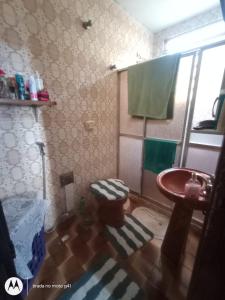a small bathroom with a sink and a toilet at Casa Bromélia in Ricardo de Albuquerque