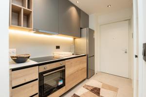 a kitchen with a sink and a stove at BW Simfonija 1 in Belgrade