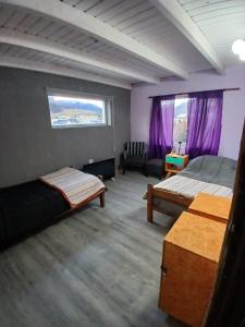 Postel nebo postele na pokoji v ubytování El Kamaruco Hostel