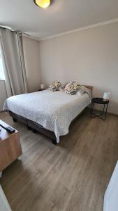 Ένα ή περισσότερα κρεβάτια σε δωμάτιο στο Comodo y acogedor departamento