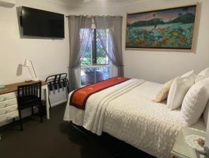 Postel nebo postele na pokoji v ubytování Coastal Escape