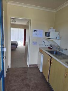 Kuchyň nebo kuchyňský kout v ubytování Alpenhorn Motel