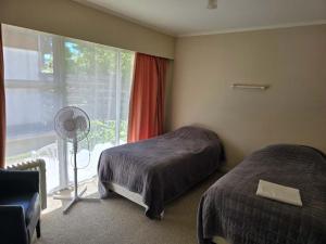 Postel nebo postele na pokoji v ubytování Alpenhorn Motel