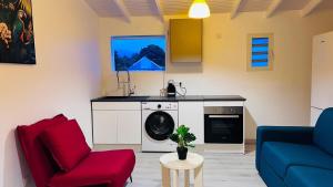 a kitchen with a washing machine in a living room at Cacao House in Capesterre-Belle-Eau