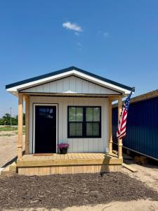 a house with an american flag in front of it at The Magnolia House in Wolf Creek
