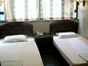 Postel nebo postele na pokoji v ubytování 1ST Homestay - HK Tai Wan Hostel
