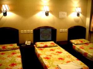 Un pat sau paturi într-o cameră la 1ST Homestay - HK Tai Wan Hostel