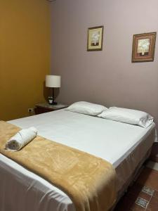 Un ou plusieurs lits dans un hébergement de l'établissement Hotel Lima Park