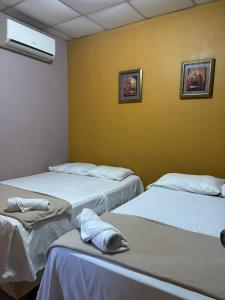 Un ou plusieurs lits dans un hébergement de l'établissement Hotel Lima Park