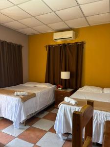 Un ou plusieurs lits dans un hébergement de l'établissement Hotel Lima Park