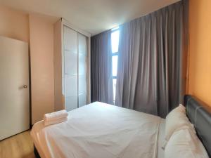 Postel nebo postele na pokoji v ubytování Roxy Hotel & Apartments