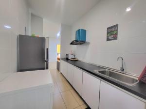 Kuchyň nebo kuchyňský kout v ubytování Roxy Hotel & Apartments