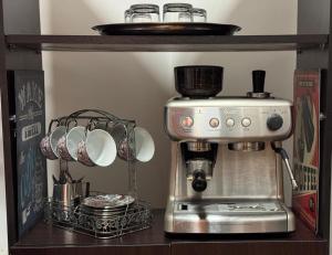 a coffee maker sitting on a shelf in a kitchen at Casa ROMERO EN FLOR in Medellín