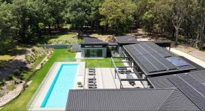 an aerial view of a house with solar panels on it at Launa Killcare Heights in Killcare