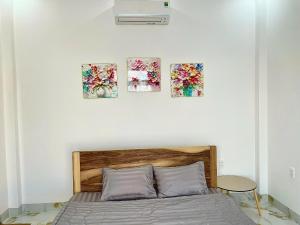 Postel nebo postele na pokoji v ubytování Phú Quý MYNO Homestay