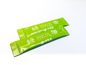 a packet of green packets with asian writing on them at APA Hotel Hakata Higashihieekimae in Fukuoka