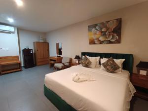 Postel nebo postele na pokoji v ubytování Abian Harmony Hotel