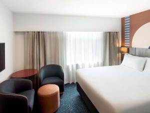 Postel nebo postele na pokoji v ubytování ibis Styles Sydney Central