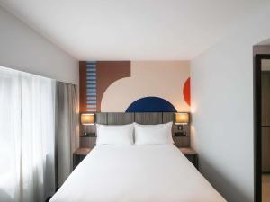 Postel nebo postele na pokoji v ubytování ibis Styles Sydney Central