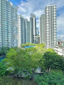 a view of a city with tall buildings and trees at Holi 1Medini Themed Suites in Nusajaya