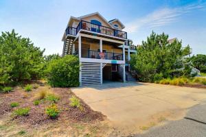 a large house with a balcony on top of it at 1700 - Carolina Delight in Poplar Branch