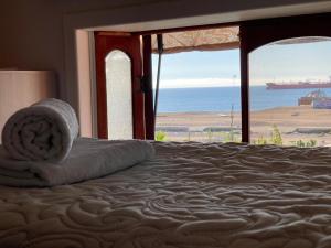 Postel nebo postele na pokoji v ubytování Hostal El Ancla