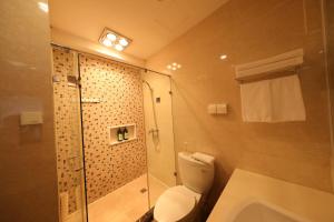 Ванна кімната в Shanghai Suju Service Apartment Pudong Wanda Plaza Zhoupu Subway Station Branch