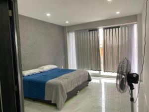 Postel nebo postele na pokoji v ubytování Hotel Arcangeles