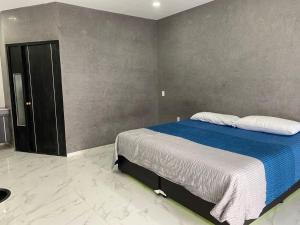 Postel nebo postele na pokoji v ubytování Hotel Arcangeles