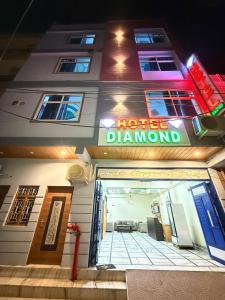 a hotel diamond sign on the front of a building at Hotel Diamond in Jaipur +9 photos