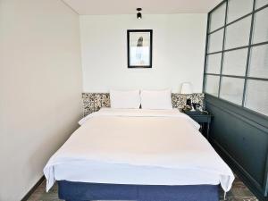 Posteľ alebo postele v izbe v ubytovaní Suncheon Hotel Gite