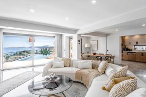 a living room with a couch and a table at Villa Onya in Bodrum City