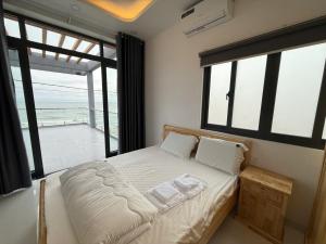 Ένα ή περισσότερα κρεβάτια σε δωμάτιο στο Oyster homestay2 +25 φωτογραφίες